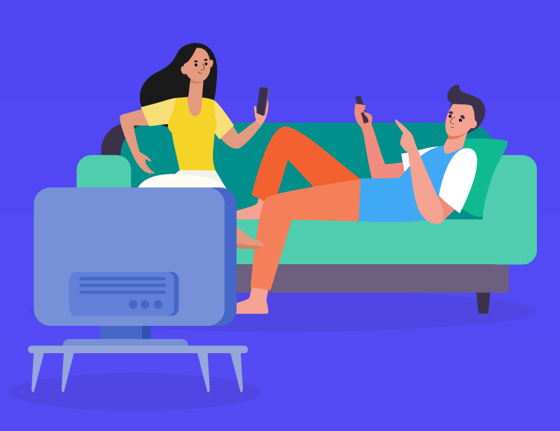 two people sitting on couch looking at phones