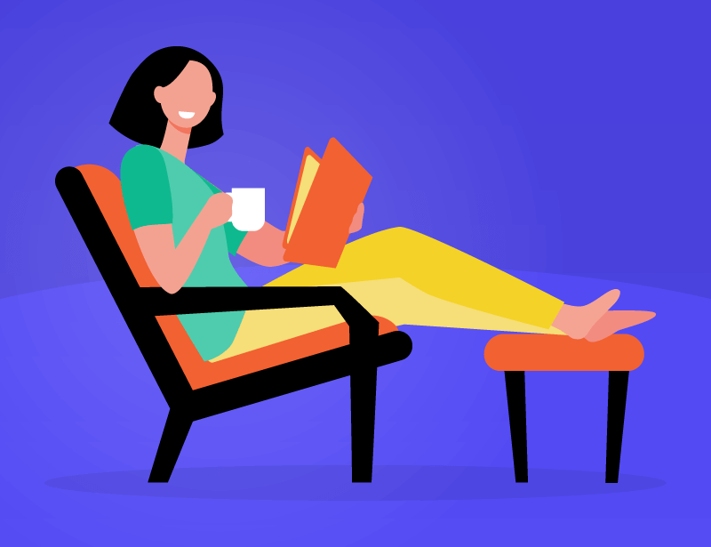 a person happily reading a book alone